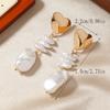 Aretes largos de borla de perlas barrocas, aretes encantadores de alta gama de lujo ligero, aretes de diseño de nicho femenino