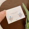 Primavera y Verano Nuevo Color Aretes de Mariposa para Mujer Flor Aguja de Plata Estilo Hada Nicho de Alta Gama Estudiante Aretes de Lazo