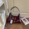 Bolsa de mão de nicho de alta qualidade estilo coreano transfronteiriça para mulheres 2026 bolsa quadrada pequena bolsa de ombro bolsa de mão casual de grande capacidade