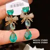 Aretes de Gema Azul Océano Endurecida al Hielo Forma de Gota de Agua Lazo Corazón Estilo Dulce Aretes de Circonita Lujo Ligero Aretes de Alta Gama para Mujer