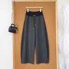 Calça banana de cor contrastante cuidadosamente selecionada feminina outono e inverno nova com cordão drapeado emagrecedor perna larga elegante versátil simples calça de perna curva