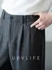 Pantalones casuales para hombre de lana con textura de espiga y cintura semi-elástica, colección otoño 2026, estilo de pierna recta con una estética "old money"