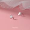 Pendientes de botón de plata pura s999 estrella de ocho puntas moda femenina lujo ligero pendientes de estrella nicho blanco y negro circón incrustado perforación de oreja