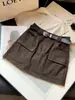 Falda de mujer dulce y fresca estilo workwear, nuevo diseño de otoño con bolsillos, de cintura alta, línea A, anti-exposición, falda corta ajustada