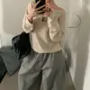 Artículo de moda coreana de Dongdaemun para mujer: el top de punto asimétrico en el hombro, que es increíblemente estilizado y elegante cuando se usa