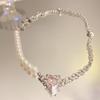 Collar de cadena de amor rosa con costuras de perlas de diseño de nicho para mujer, nuevo estilo, dulce y moderno, cadena de clavícula de alta gama.