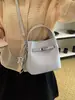 2026 Novo Estilo Bolsa Kelly Pequena Feminina Mori Fofa Tendência Super Quente Nicho Ombro Único Portátil Bolsa Transversal para o Dia a Dia