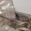 Tejido de vidrio laminado de doble capa con hilo de plata tejido, hilo de poliéster TC, mezcla de poliéster-algodón, seda color café, lámina de plata, tejido de cuero plateado