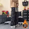 Calça masculina da moda com estampas all-over, estilo high-street, legal e estilosa, inspirada no Instagram, forrada com fleece, calça longa casual, calça larga solta, marca da moda para homens