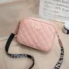 Bolso de mujer nuevo de rombos con borla, bolso cuadrado pequeño, bolso de hombro cruzado, bolso de cámara de moda con lazo, bolso pequeño transfronterizo, moda