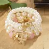 Pulsera blanca de perlas de imitación, pulsera de moda de estilo resort costero de 4 hilos multicapa con estrella de mar, suministro mayorista transfronterizo