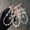 Elegante correa de cristal con cuentas para teléfono con colgante de girasol de circonita, cordón para teléfono, accesorio para muñeca y bolso, anti-pérdida