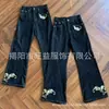 Jeans Negros Desgastados Estilo Retro Americano 2026 Unisex Diseño Bordado Pierna Ancha Micro Campana Estilo High Street