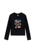 Camiseta negra de cuello redondo, hombros normales, manga larga para mujer, nuevo estilo primavera y otoño, estampado de graffiti de dibujos animados, corte ajustado, top dulce y picante para chica