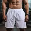 Shorts de malha de secagem rápida para homens, adequados para treino de fitness, calças de basquete estilo americano, shorts de corrida de comprimento médio, shorts esportivos largos para homens, estilo verão