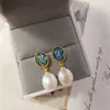 Novos brincos femininos de e-commerce transfronteiriço europeu e americano mais vendidos: pérola natural, moda vintage popular, brincos criativos para senhoras