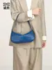 Bolsa Baguette de Venta Caliente Europea y Americana Moda Bolso de Hombro Único Debajo del Brazo Color Sólido Cuero Suave Tejido Bolso para Mujer Cruzado Bolso Dumpling Moderno