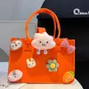 Bolsa de fieltro de felpa de dibujos animados, bolsa de regalo para el primer cumpleaños y mes completo del bebé, bolsa de mano personalizable para el día a día, se puede imprimir con logo, bolso de hombro