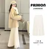 Falda de Lana Plisada Fina Color Crema para Mujer, Nueva Falda de Cintura Alta Línea A Adelgazante de Longitud Media Otoño e Invierno 2026