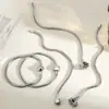 Nuevo Pulsera de Acero de Titanio Redonda Serpiente Corazón Colgante Pulsera para Mujer Nicho Lujo Ligero Gama Alta Transfronterizo Popular Pulsera