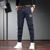Pantalones deportivos casuales de verano finos con cintura elástica para hombre, elásticos, ajustados, estilo skinny, nuevos, combinan con todo, de seda helada para hombre