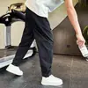 Nuevos pantalones casuales de otoño para hombre, empalmados, corte ajustado, marca de moda, versátiles, holgados, de pierna recta, jogger, secado rápido, pantalones deportivos