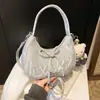 Bolsa Única com Laço para Axila Feminina, Nova Bolsa Meia-Lua Verão 2026, Bolsa Dumpling Texturizada para o Dia a Dia, Bolsa Transversal da Moda