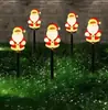 Luces solares LED navideñas de suelo transfronterizas, luces ambientales, luces navideñas acrílicas, luces decorativas para césped al por mayor