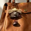 Encantador perrito peludo con la lengua fuera, llavero para bolso, colgante de dibujos animados natural, semillas de terapia de sonido curativas, popular en zonas escénicas, amuleto divertido y adorable