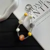 Nuevas Cuentas Ojo de Gato Falsas Cuentas de Semilla Lanyard para Teléfono Móvil Llavero Creativo Colorido Colgante para Bolso Venta al por Mayor