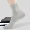 Calcetines vendidos por jin calcetines desechables para hombre y mujer calcetines de vestir clásicos de color liso sin lavado para todas las estaciones de media pantorrilla calcetines desechables diarios