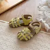 Sandalias Infantiles 2026 Verano Nuevo Estilo Niñas Lazo Hueco Zapatos de Princesa Niñas Pequeñas Romanas Tejidas Suela Suave