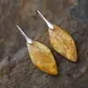 Nuevos pendientes colgantes de hojas de piedra natural bohemios europeos y americanos de moda, joyería retro de estación independiente transfronteriza.