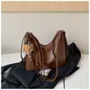 Mochila casual de gran capacidad para mujer 2026 nueva mochila para el trabajo bolsa de hombro cruzada de color liso elegante