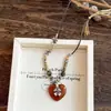 Collar con Colgante de Corazón y Cruz de Piedra con Cuentas Estilo Étnico Cadena de Clavícula Simple Elegante Joyería de Nicho de Alta Gama