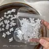 Decoraciones para uñas de flor de cristal de hielo tallada suave, modernas y versátiles, blanco translúcido, flor de cuatro pétalos tridimensional para decoración de uñas, pedrería de resina, al por mayor