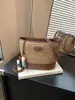 Bolso de Paja 2026 Verano Nuevo Gran Capacidad Moderno Versátil Tejido de Hombro Cruzado Informal Tipo Cubeta Transfronterizo