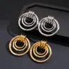 Pendientes Redondos Huecos Geométricos de Brillo Metálico Transfronterizos Europeos y Americanos, Exagerados y Únicos, con un Toque de Alta Gama