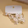 Pendientes de borla de flor de concha blanca transfronterizos europeos y americanos con perlas, pendientes de estilo de corte francés, pendientes ligeros y lujosos con un toque de alta gama