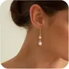 2026 Amazon Comercio Electrónico Transfronterizo Pendientes Largos Colgantes Perla Dorada Fiesta de Boda Novia Pendientes de Nicho
