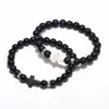 Pulseira de contas de vidro transfronteiriça bola de vidro fosco pulseira de corda elástica trançada pulseira de casal cruz preta e branca personalização