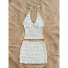 Nuevo top de verano sexy para mujer para vacaciones con tela texturizada y cuello halter, combinado con una falda de color liso
