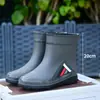 Botas de lluvia transfronterizas, unisex, altura media hasta la pantorrilla, antideslizantes, impermeables, con puños elásticos, adecuadas para el trabajo, venta al por mayor, versátiles, antideslizantes y duraderas