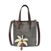 Bolso Pequeño Tejido de Paja Calado de Verano para Mujer 2026 Nuevo Casual Simple Tejido para Teléfono Bolso Cubo de Moda Versátil