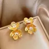 Aretes de Flores con Textura Metálica para Mujer Aretes de Diseño Nicho 2025 Nuevo Estilo Caliente Aretes Únicos de Gama Alta para Mujer