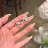 Brincos Yoyo Huaxinzi Pérola Francesa Imitação Flor Oca Temperamento Doce Brinco Feminino