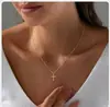 Collar de Cadena para Clavícula con Colgante de Cruz de Diamantes de Invierno Chapado en Oro Real de Latón de Venta Caliente Europea y Americana Collar Nuevo 2025
