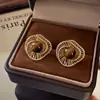 Aretes Huecos de Flor Ojo de Tigre Maillard para Mujer Súper Hermosos Únicos Bonitos Aretes de Botón Nuevo Estilo Caliente 2026 Accesorios para Pendientes