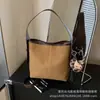 Bolsa tipo balde de alça larga estilo coreano para mulheres, novo modelo 2026, bolsa de ombro casual de grande capacidade para ir ao trabalho e lazer