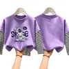 Camiseta de Manga Larga de Algodón Puro para Niños Otoño 2026 Holgada Versátil Cuello Redondo para Niños con Diseño Falso de Dos Piezas
